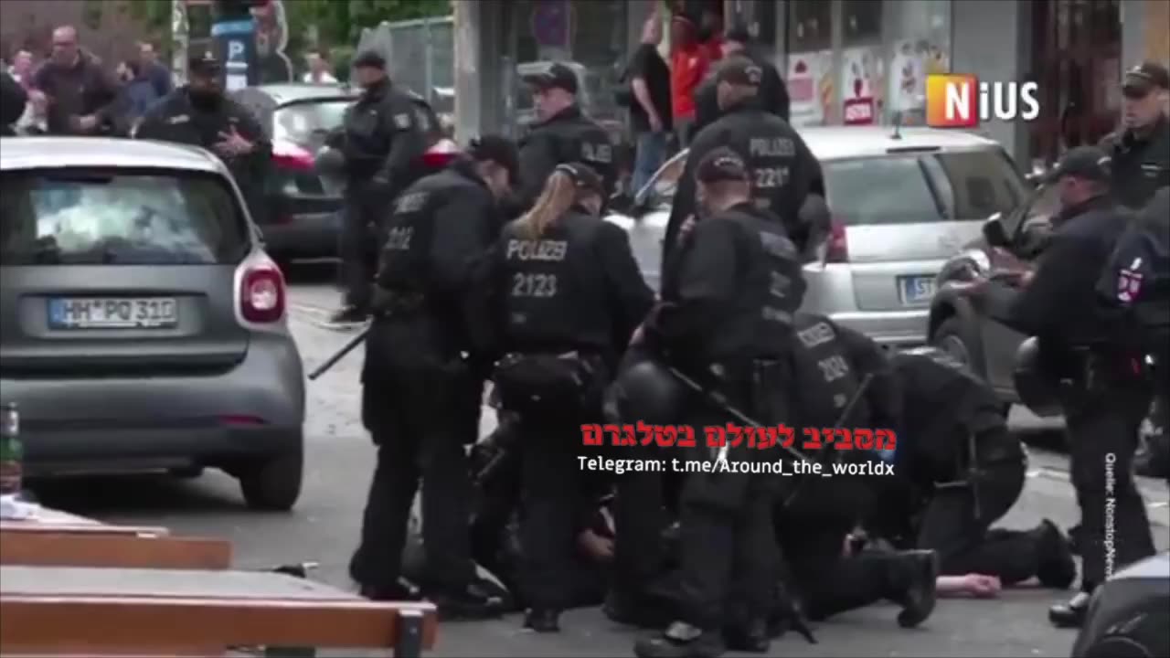 German police shooting down a man who try to kill Holland fans with an axe