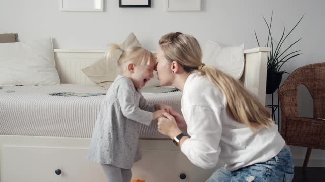 Mother and Daughter having fun at Home