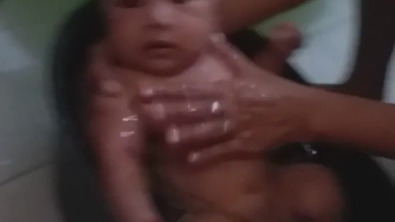 Cute baby bathing