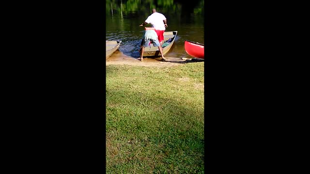 Portly Man Takes Spill Out Rowboat