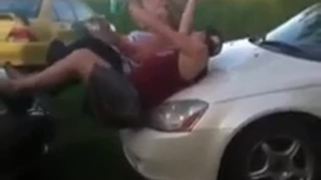 Guy jumps on car hood faceplant