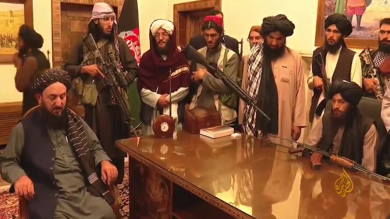 Taliban soldiers reciting Quran verses inside the presidential palace in Kabul.