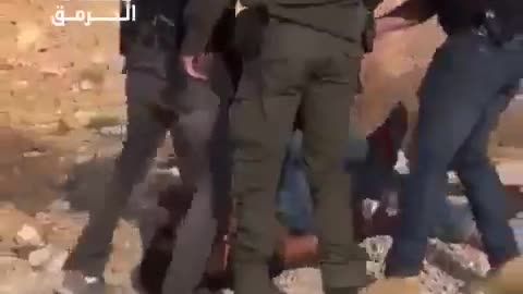 Israeli forces brutally assaulting a young Palestinian man