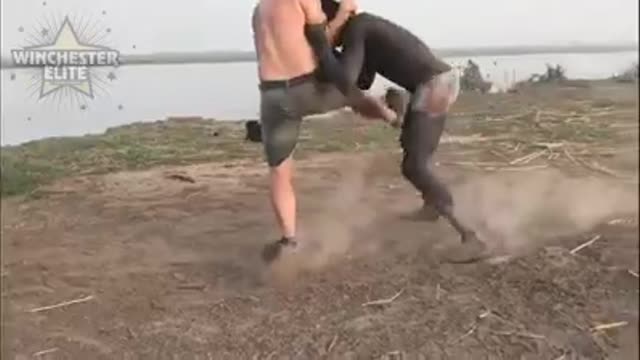 Wrestling Between White Man And Black Man.