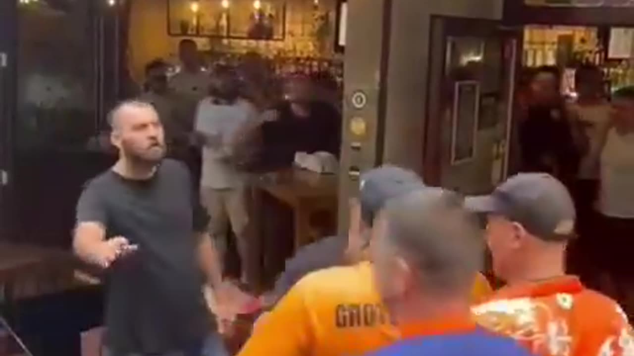 Netherlands fans attacking a pub full of England fans