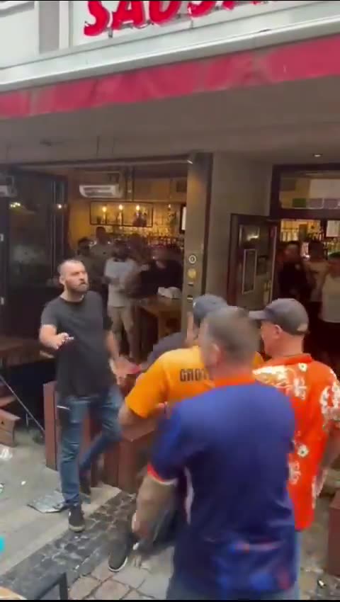 Netherlands fans attacking a pub full of England fans