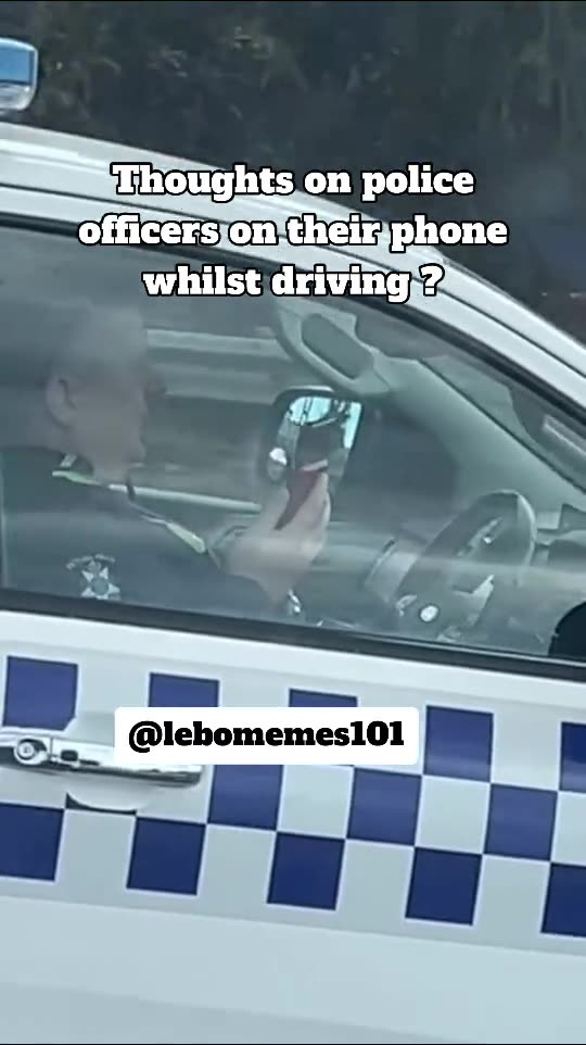 Cop Uses Phone While Driving