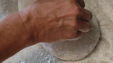 Cutting the surface of formed bread