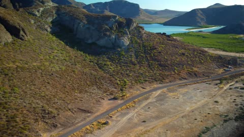 Aerial panorama of a landscape with mountains and a lake