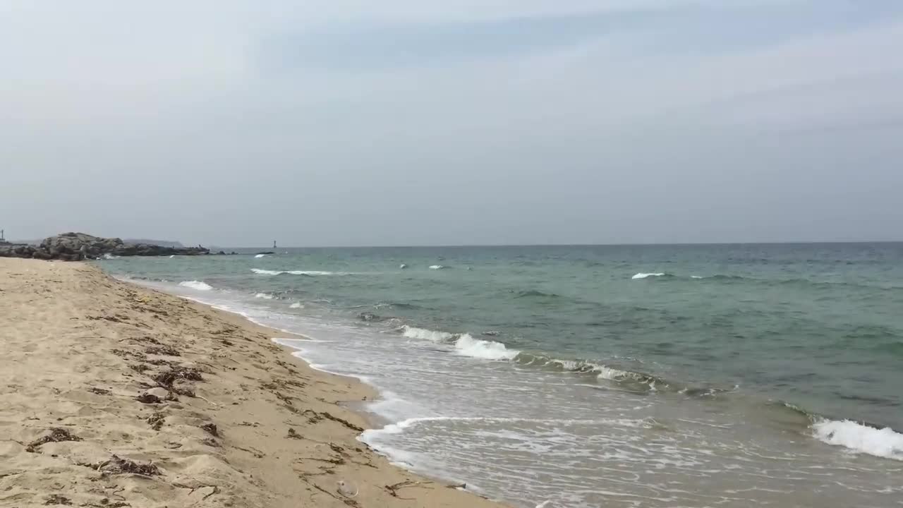 Gentle ocean waves hitting donghae.