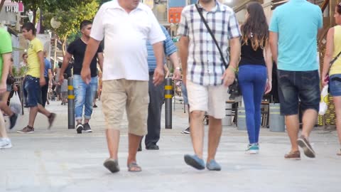 People walking roaming round free