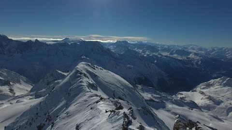 The Alps are snow-capped white peaks!