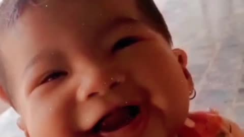 Adorable baby laughs funny