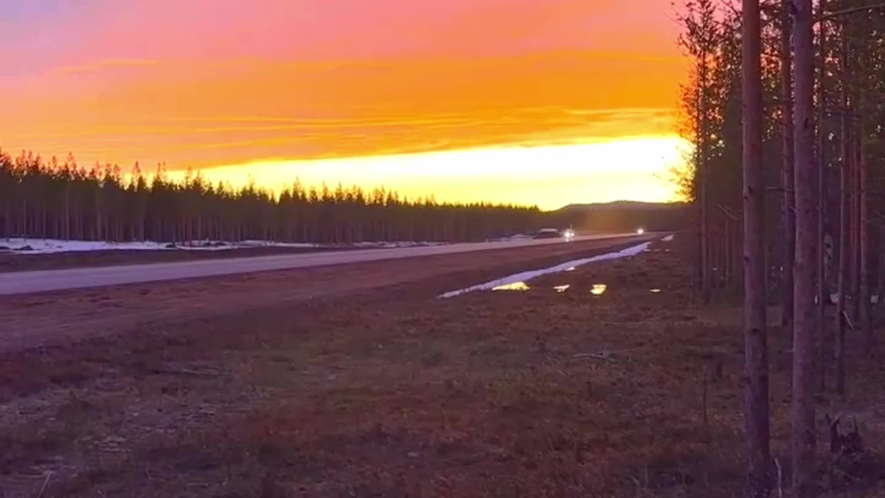 Swedish JAS-39 Gripen takes off in the glow of sunset