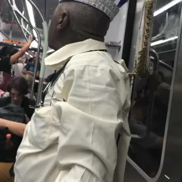 Guy white shirt huge jesus crown on subway
