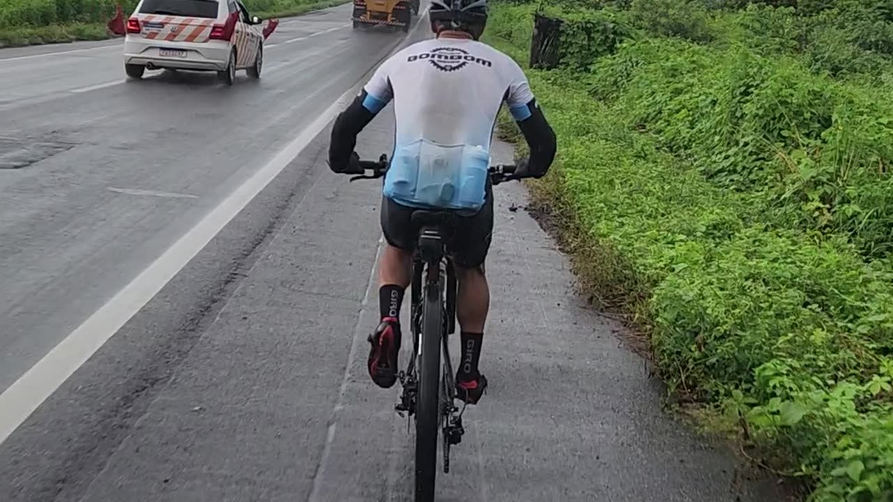 Cyclist Passed By Giant Wind Turbine Blade