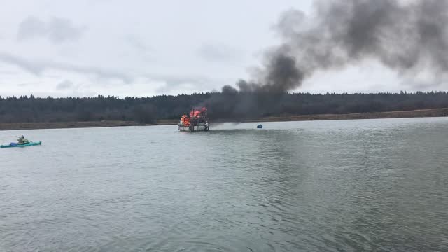 Kayak Rescues Fisherman from Burning Boat