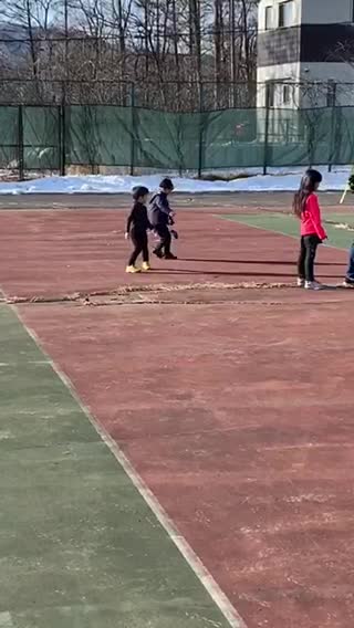 A 4 years old boy is trying to warm up