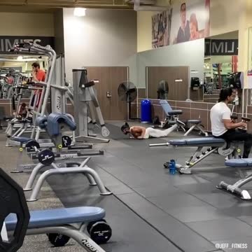 Dude works on his swimming strokes at the gym