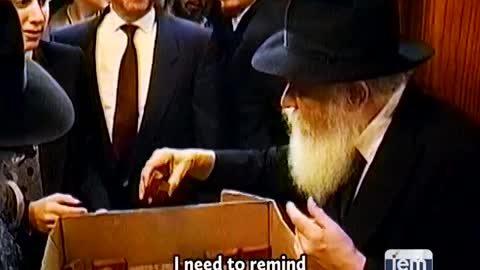 14. The Rebbe distributes honey cake for a sweet new year