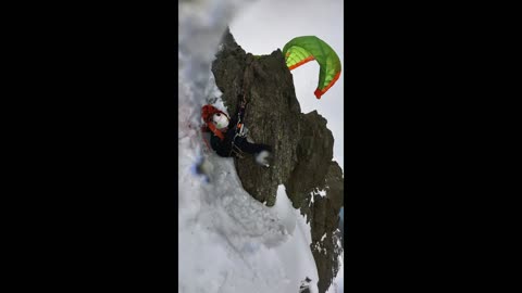 Paraglider Catches On Rock