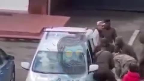 Ukrainian civilian is dragged screaming to the Jewish meat grinder.