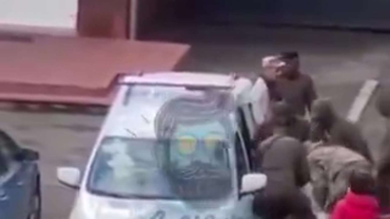 Ukrainian civilian is dragged screaming to the Jewish meat grinder.
