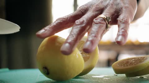 Slow motion of cutting oranges