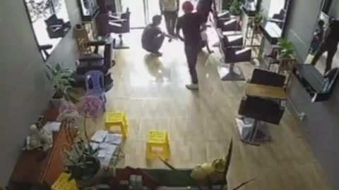 The glass is hit by an unknown man