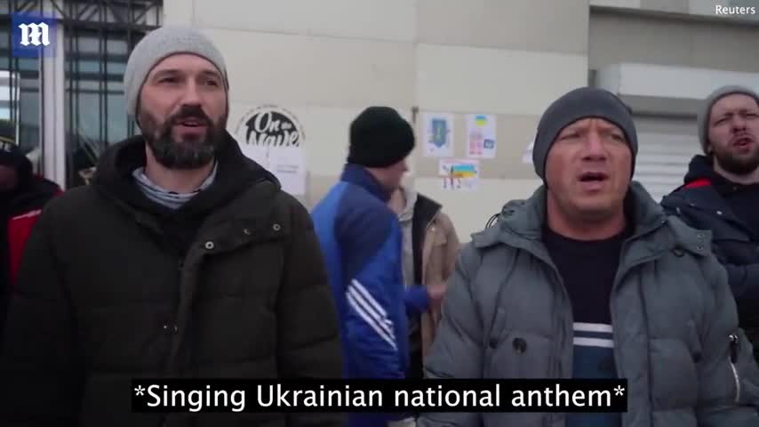 Ukraine fights back_ Ukrainians sing national anthem as they fill sandbags in Odessa