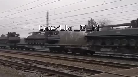 Russian train With Russian Military vehicles on it's way to the front