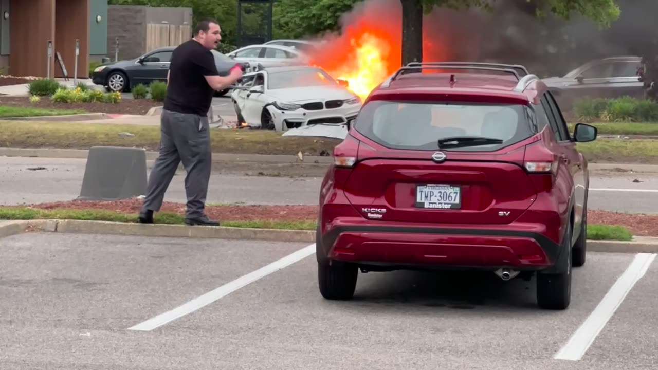 People Pull Passengers Out of Burning Car