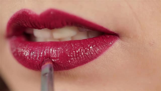 Beautiful Women Close up Applying Dark Red Lipstick - Women's Club Trend