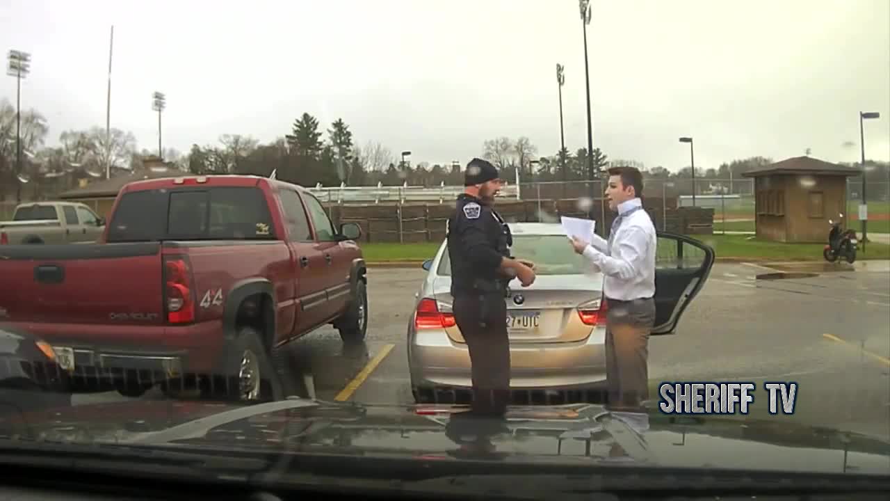 Police officer in Wisconsin pulls over student for speeding, then helps him tie his tie.