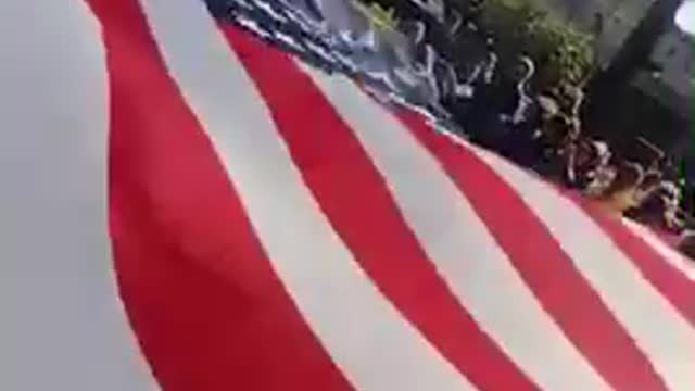 Giant flag being waved at freedom rally October 16,2021