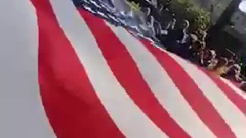 Giant flag being waved at freedom rally October 16,2021