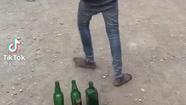 crushes bottles with head