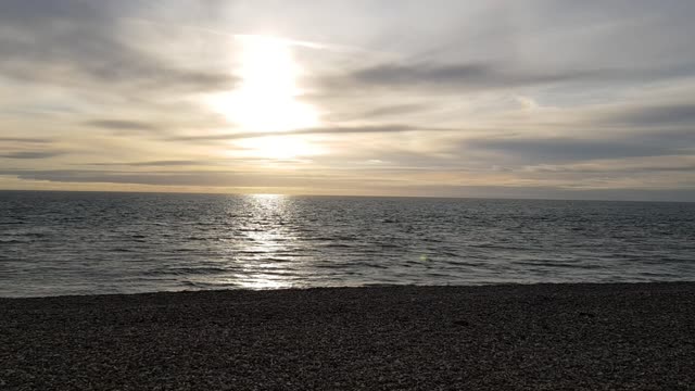 Sunset over a calm sea. On the solent uk