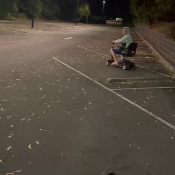 Trying to park a motor scooter