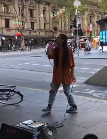 Woman singing in the street