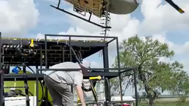 Helicopter lands perfectly on top of truck