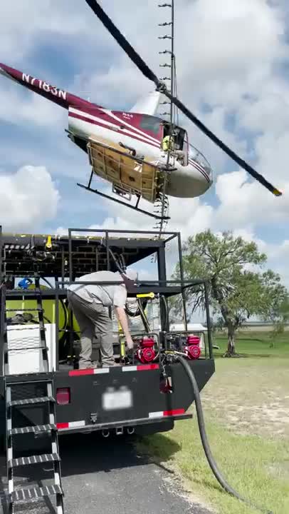 Helicopter lands perfectly on top of truck