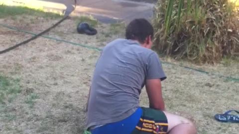 Grey shirt guy backyard back flip fail