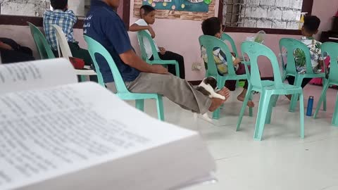 Guy in Church Swings Puppy with His Feet