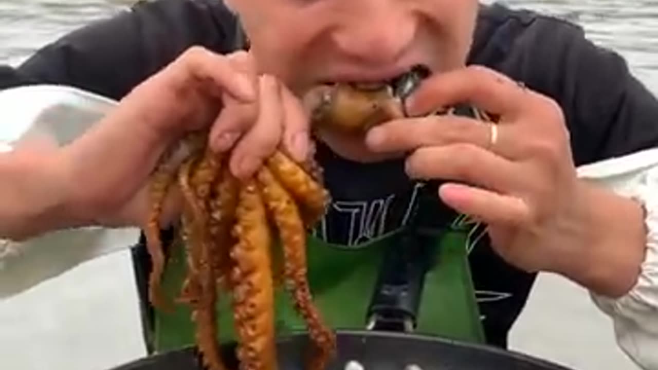 Chinese Fisherman Cooking and Eating seafood