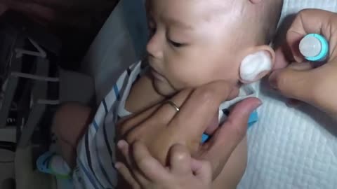 Cute baby ear wax removing