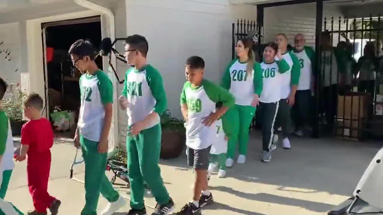 Family of 70 wear Squid Game outfits for EPIC Halloween party in Texas