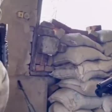 Ukraine War - A FSVNG employee fires from a GM-94 hand grenade launcher