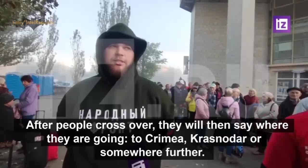 Russian citizens stand in queue as authorities prepare to evacute up to 60,000 residents