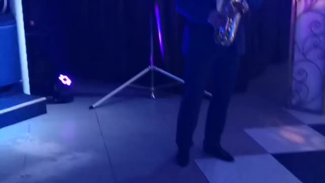 The musician plays the saxophone